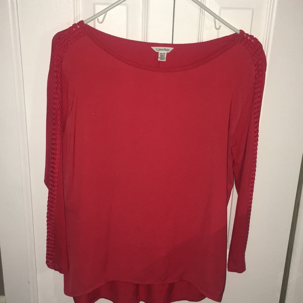 Red Calvin Klein quarter sleeve with side opening
